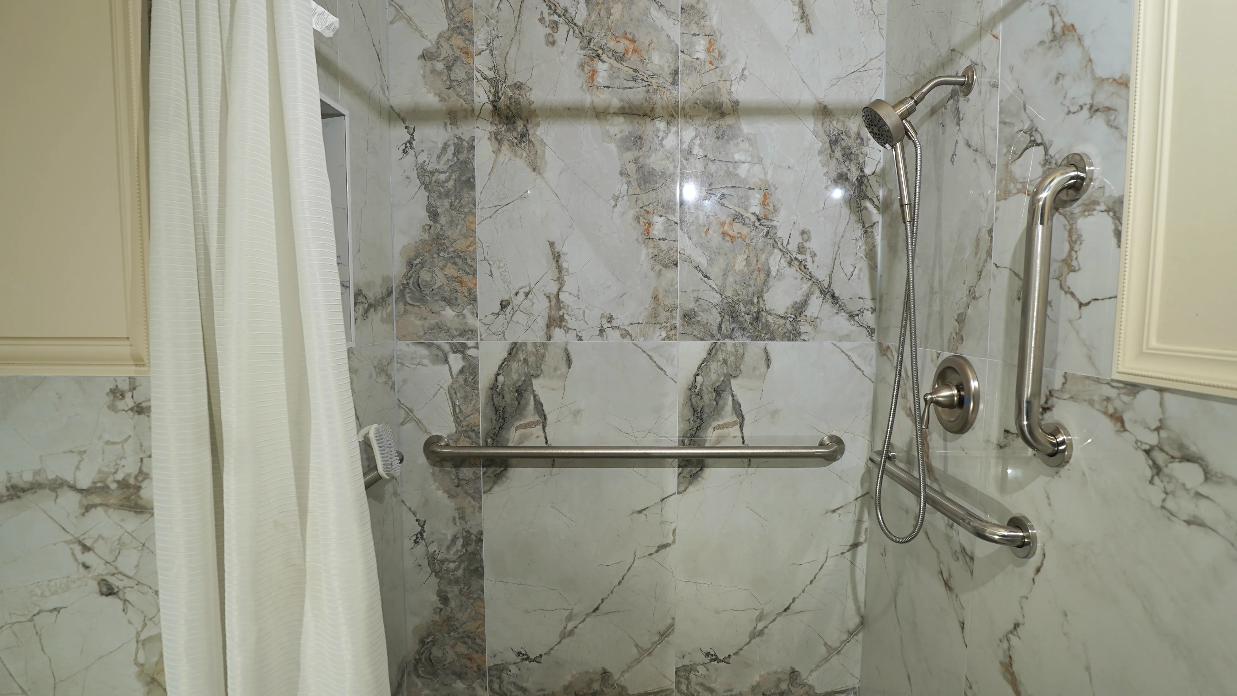 Accessible walk-in shower with grab bars
