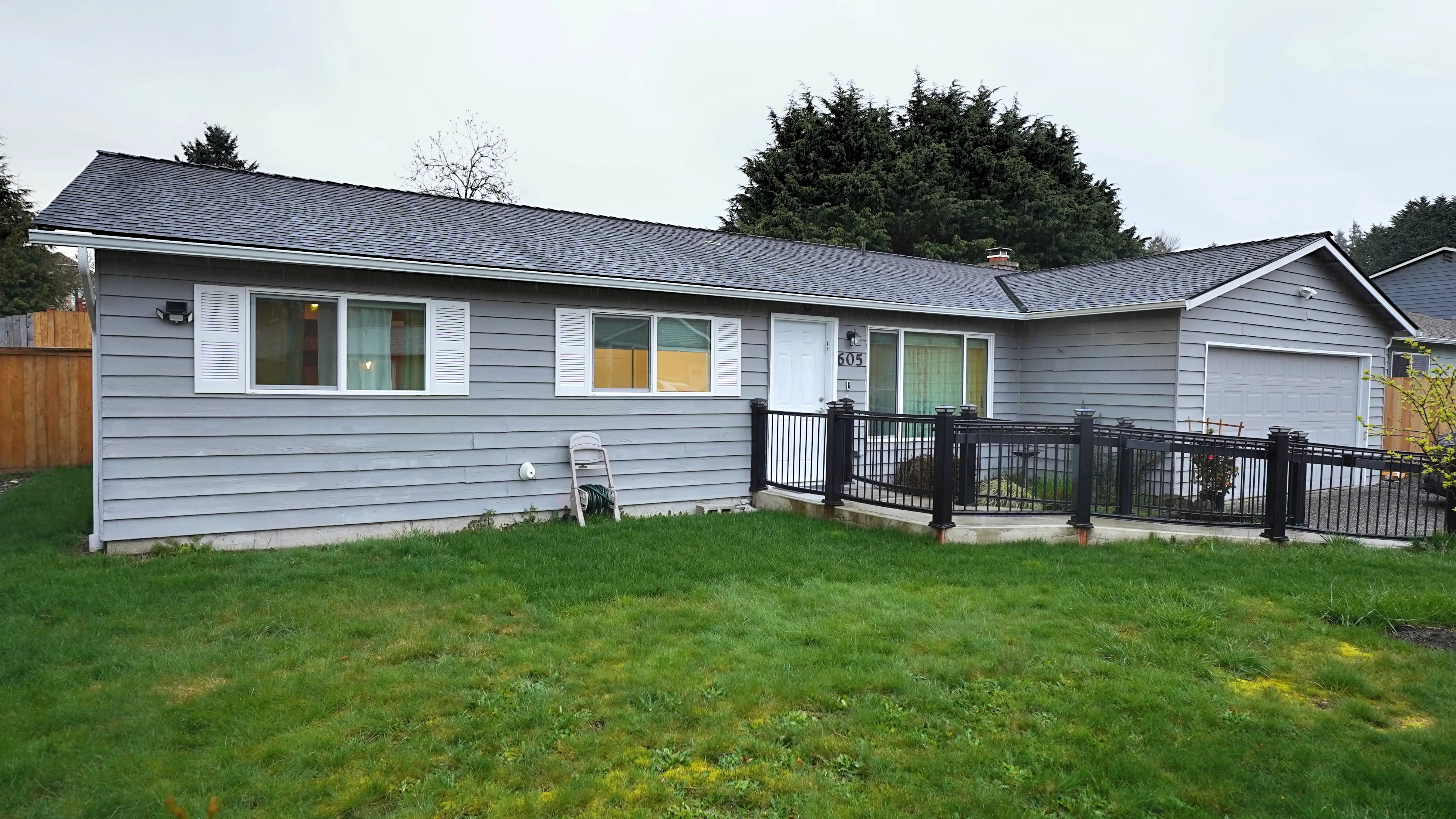 Home with landscaped front lawn